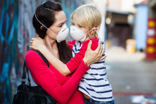 Woman and son wearing face masks