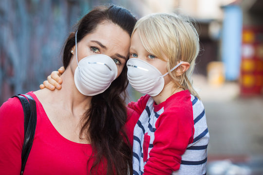 Mother and son wearing face masks