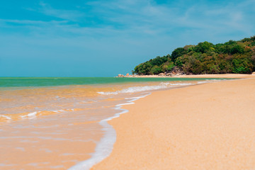 Tropical nature clean beach and white sand in summer with sun light blue sky and bokeh background.