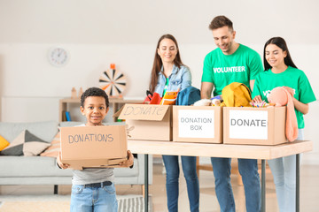 Volunteers with donations at orphan home