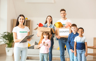 Volunteers with donations and children at orphan home