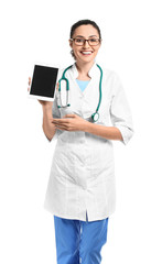 Portrait of young female doctor with tablet computer on white background