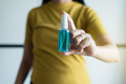 Woman Hands Holding Sanitizer Gel In Spray Bottle For Hand Hygiene Coronavirus Protection