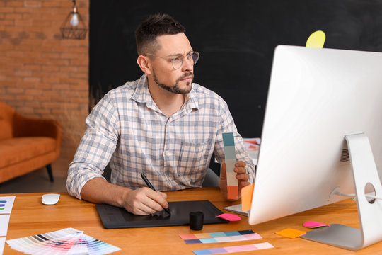 Male designer working in office - Powered by Adobe