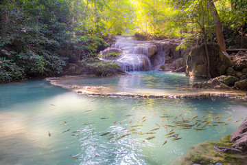 Landscape of Erawan waterfall in national park Is a waterfall in the deep forest with antimony fish at Kanchanaburi, Thailand.