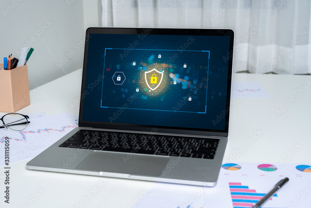 Poster person using a laptop computer with data protection, cyber security, information safety and encrypti