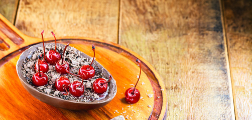 brazil easter egg, spoon egg, with creamy chocolate filling and fresh cherries. Easter cake typical of Brazil.