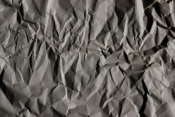 Crumpled paper background, copy space for text. Cropped shot of paper texture. Abstract texture backdrop.