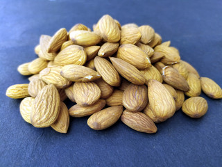 fresh healthy almonds isolated on seamless background
