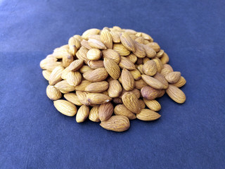 fresh healthy almonds isolated on seamless background