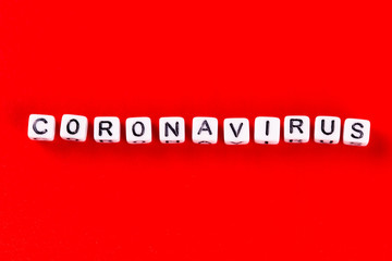 Pandemic and virus concept - Coronavirus word made of white blocks. Coronavirus text on red background.