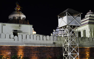 Sri jagannath temple boundry wall at night with colorful yellow