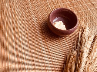 Authentic face treatment tools on bamboo.