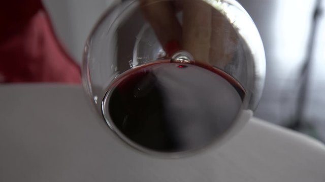 Red Wine swirl by a sommelier and Norton red wine in slow motion 4k footage.