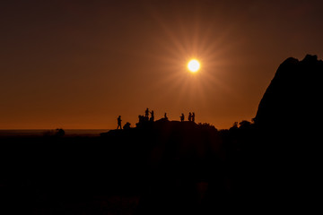 Fototapeta na wymiar silhouette of people at sunset