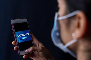 young woman reading virus corona information