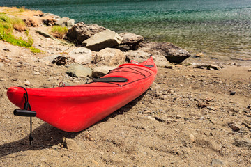 Kayak on water shore.
