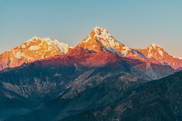 Plakat Majestic view of sunset sweeping through Annapurna South and Himchuli from Poon Hill, Ghorepani, Nepal