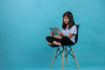 little girl smiling with tablet 