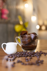 A cup of ice coffee with coffee beans, Black coffee isolated, Roasted coffee beans in bottles,