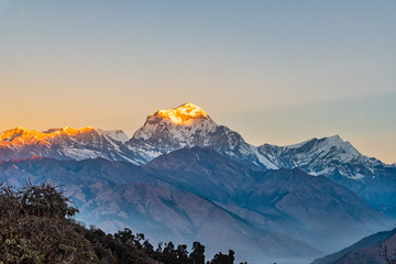 Beautiful sunrise light kissing Dhaulagiri mountain summit viewed from Poonhill Ghorepani Nepal