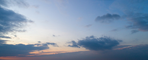 Fototapeta na wymiar Large panorama of evening sunset sky with beautiful clouds.