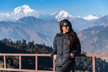 Cercles muraux Dhaulagiri Beautiful girl posing infront of Dhaulagiri mountain range, Pokhara, Nepal