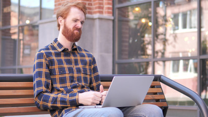 Redhead Beard Young Man Frustrated by Results, Sitting Outside Office