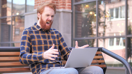 Redhead Beard Young Man Upset by Results, Sitting Outside Office