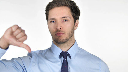 Thumbs Down by Young Businessman on White Background