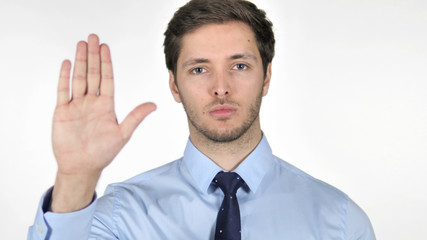 Stop Gesture by Young Businessman on White Background