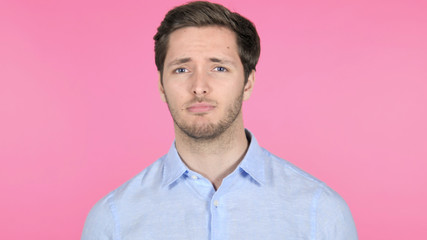 No, Disliking Young Man on Pink Background