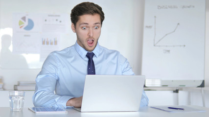 Wow, Surprised Young Businessman Working on Laptop