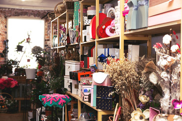 Product racks in a small flower shop. Background.