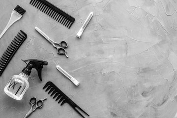 Beauty saloon concept. Hairdresser accessories pattern on grey stone background top-down frame copy...