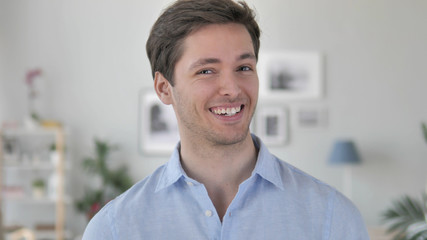Yes, Positive Handsome Young Man Accepting Offer by Shaking Head