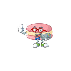 Talented strawberry macarons gamer mascot design using controller