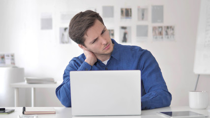 Casual Adult Man with Neck Pain at Work