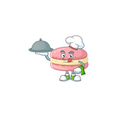 chef cartoon character of strawberry macarons with food on tray