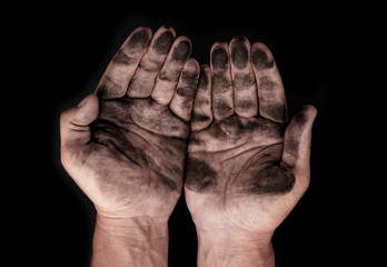 dirty male hands on a black background
