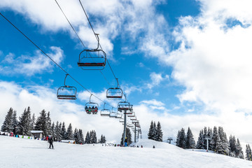 View of the chairlifts of the Morzine ski slopes in the French Alps during winter