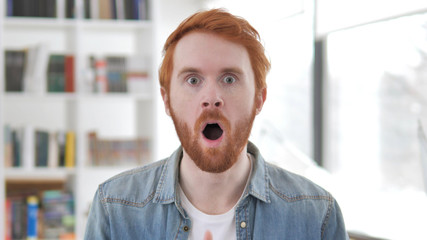 Young Casual Redhead Man in Shock