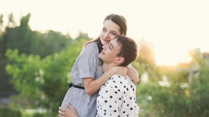 Loving man and woman having sweet tender moment together, happy millennial couple smile caressing each other, young husband and wife enjoy tenderness in summer day.