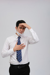 businessman man with thermometer feeling sick, headache from flu virus bacteria infection pollution