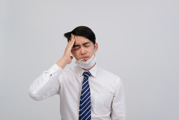 businessman man with thermometer feeling sick, headache from flu virus bacteria infection pollution