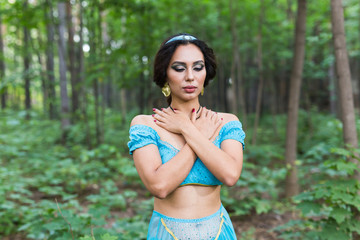 Portrait of princess Jasmine, a young woman in the image of an Eastern fairy Princess outdoor.