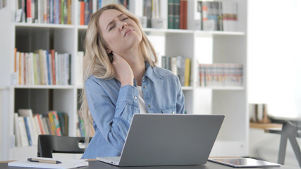 Tired Young Blonde Woman with Neck Pain at Work