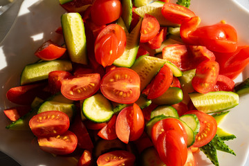a salad of sliced tomatoes and cucumbers.