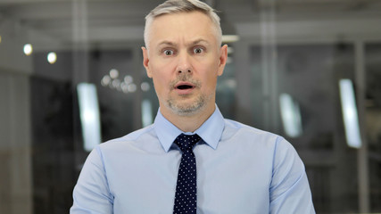 Portrait of Grey Hair Businessman in Shock, Wondering in Awe