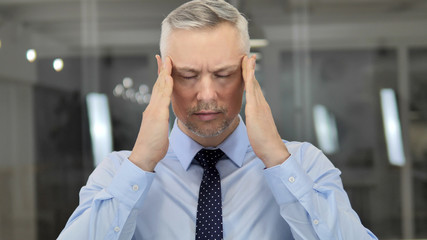 Headache, Portrait of Tense Grey Hair Businessman in Office